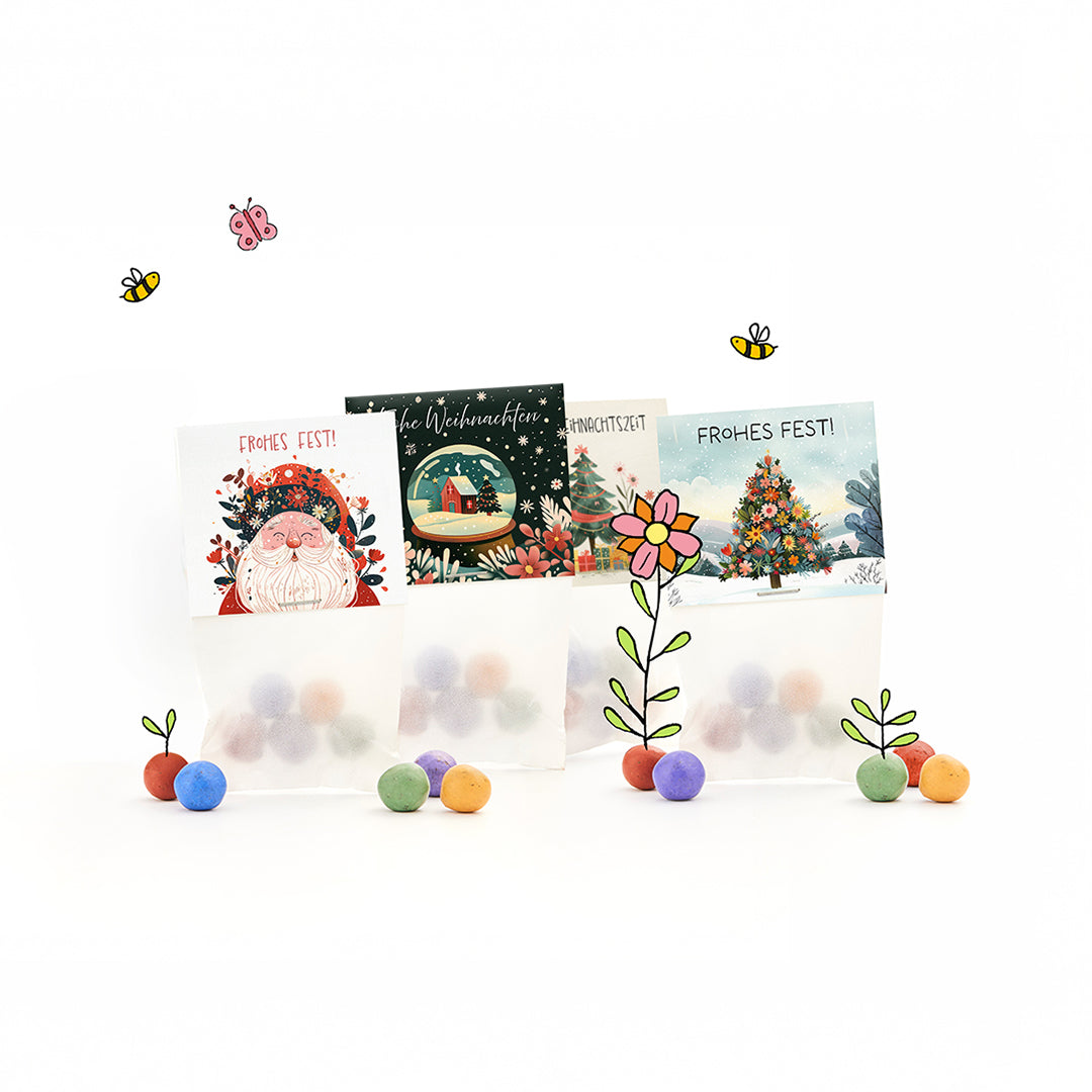 Kleine Weihnachtsgeschenke mit 12 Tütchen Blumenmurmeln in vier Weihnachtsmotiven