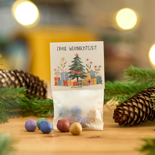 Blumenmurmeln Frohe Weihnachtszeit als kleine Weihnachtsgeschenke zum Verteilen